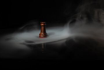 Single chess rook surrounded by smoke on a dark background, symbolizing strategy, leadership, decision‑making, power, stability, planning and high‑level strategic thinking. © Artur