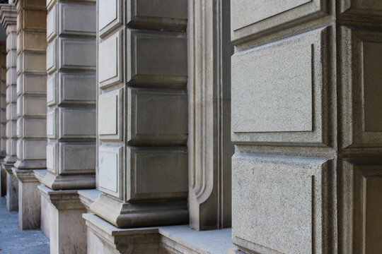 Architectural detail of the corner of a stone building facade