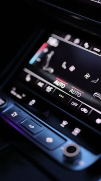 Vertical video of male hand pressing emergency light button on car dashboard. Activating the hazard lights of a vehicle by pressing the button on the dash. Car emergency light signal, warning sign