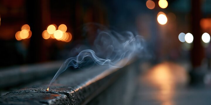 A serene image of incense smoke swirling in an atmospheric background, conveying a sense of calmness and spiritual connection.