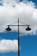 Obraz premium Vintage Street Lamp Against Blue Sky