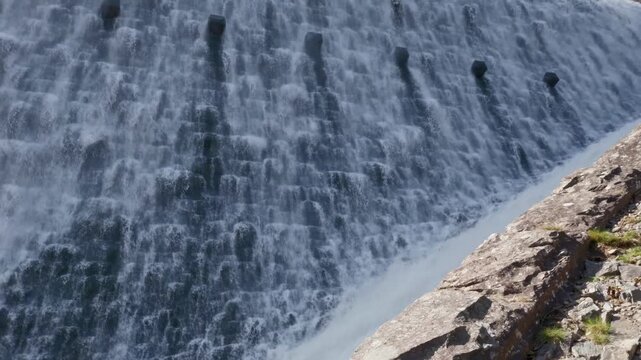 close up shot of overflowing Cabon Coch dam, Elan Valley