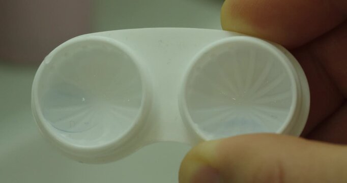 Macro Close Up of Contact Lens Case with Lenses Stored in Solution
