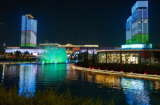 Tashkent, Uzbekistan- October 4 2024: Tashkent City Park and the far view of Tashkent city mall with the reflection of Uzbekistani flag