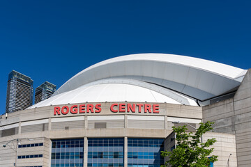 Naklejka premium Toronto, Canada - May 30, 2026: Exterior of the Rogers Centre, a multi-purpose retractable roof stadium in downtown Toronto, Canada. 