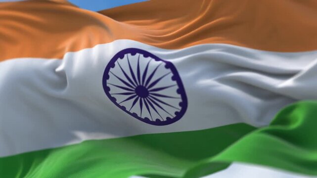 Vibrant Indian National Flag Waving Proudly with Detailed Ashoka Chakra and Dynamic Fabric Folds against Blue Sky