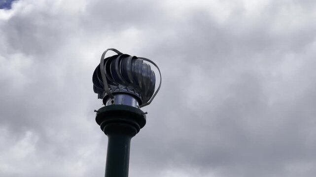 spinning air vent pipe on a cloudy day