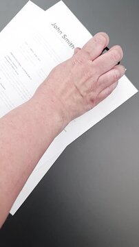 ATS Approved stamp on Fake mock CV (curriculum vitae) resume, concept of job application approved by ATS and automated recruitment screening.