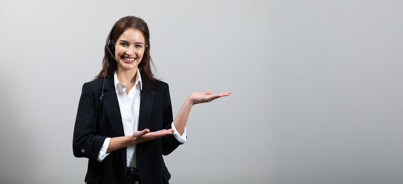 Attractive business woman in suits and headsets are smiling while working isolate on white background. Customer service assistant working in office. VOIP Helpdesk headset