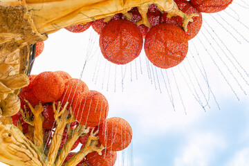 Peschiera Del Garda, Italia - April 30, 2026: Colorful decorative tree with large red spheres and cascading water features at Gardaland Park amusement venue in Italy © Nizoli