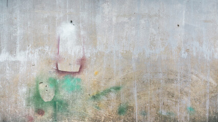 Old weathered concrete wall with colorful spray paint graffiti. Street art texture background. © RilakkuMaxx