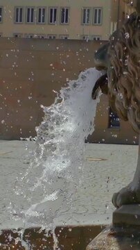 Fountain against the background of the sky in the rays of the setting sun