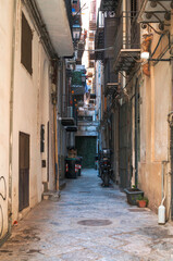 Fototapeta premium Life in a narrow stone alley.