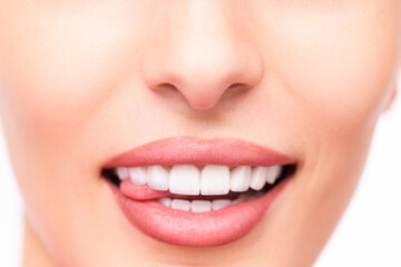 Naklejka premium Detailed facial shot showing perfect teeth and soft pink lips
