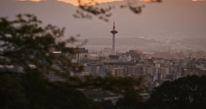Sunset glow on beautiful Japanese city with light haze - wide, tilt shot