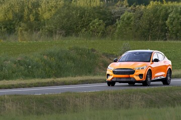 Fototapeta premium Premium electric SUV on open European road