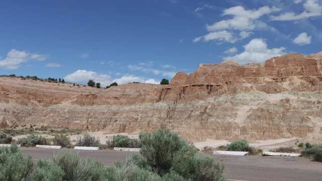 Wide panoramic view of blue sky and clouds over the beautiful rock wall at Cathedral Gorge State Park in Nevada