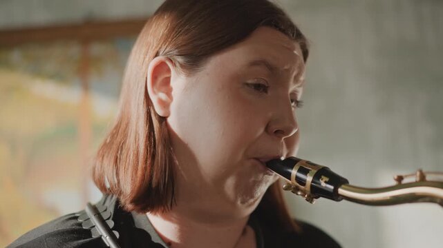 Caucasian woman performing saxophone solo in moody studio with painting backdrop, expressive phrasing, improvisation focus, closeup tone exploration, intimate rehearsal energy, seasoned musician