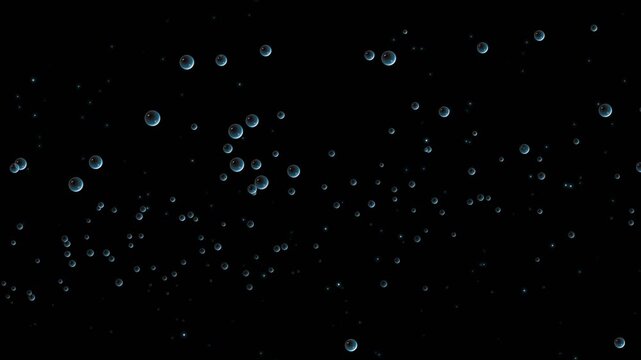 Air bubbles rising up in water on black background