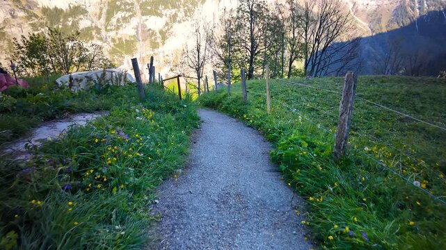 Point of view walking a mountain trail in Lauterbrunnen