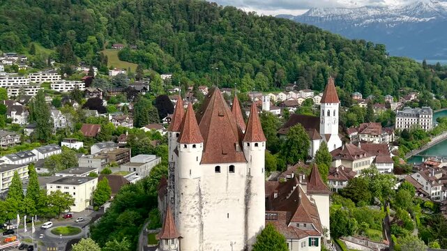 Medieval Thun Castle overlooking the city and lake in Switzerland.