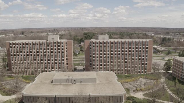 Aerial Drone View of High Rise Brick Apartment Michigan State University dorm Building Complex Urban Skyline