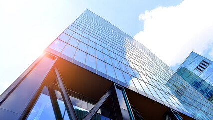 Obraz premium Steel and glass. The subject of modern architecture or construction industry. Modern office building facade with tall steel construction elements and full height windows between.