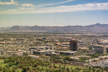 Obraz premium Wynn Golf Club. Las Vegas Valley, Clark County, Nevada. Basin and Range Province, Mojave Desert. from Encore Las Vegas. In the distance are MacDonald Highlands and Black Mountain (McCullough Range).