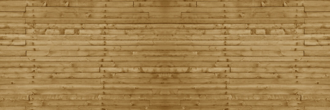 Texture of the wall made of brown yellow beige varnished wooden panels with multiple knots as a background