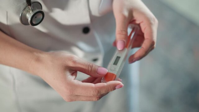 Caucasian home doctor teaching self testing with device, closeup of hands and digital display, portable kit used at bedside, step by step guidance, supportive tone and patient empowerment