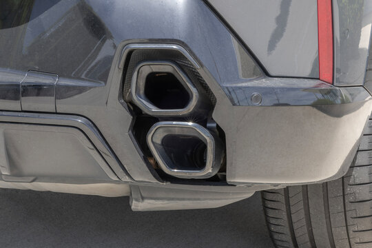 Performance exhaust pipes with geometric tips. Closeup of exhaust pipes from a car muffler.
