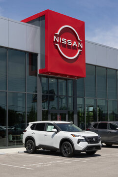 Nissan Rogue SV Crossover SUV at a dealership. Nissan offers the Rogue with a 201HP 1.5L DOHC Turbocharged engine. MY:2026