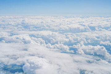 Naklejka premium Flying high above clouds covering switzerland landscape
