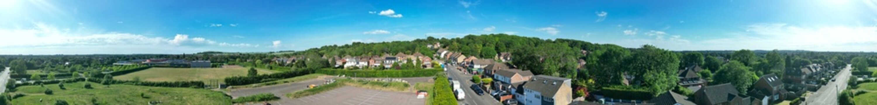 Aerial Ultra Wide Panoramic View of Residential District of Luton City During Clear Blue Sky. Drone Flight Above Urban City Streets of British City and Town of England Great Britain. 