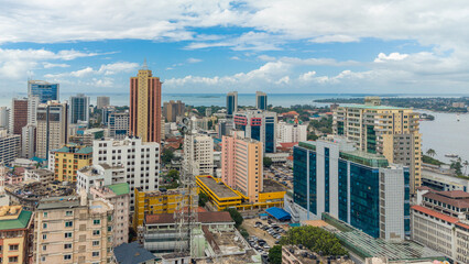 Aerial view of Dar es Salaam showcasing modern buildings, urban development, and a dynamic cityscape. © STORYTELLER VISUALS
