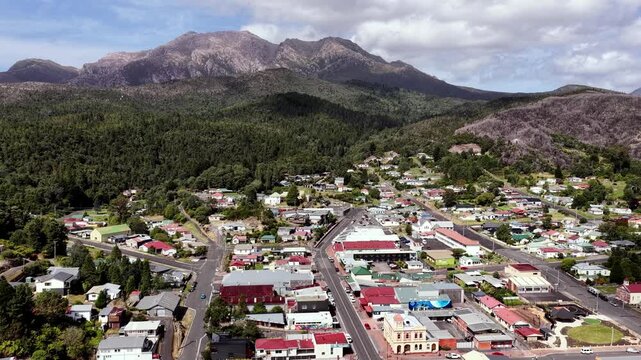 Aerial cityscape view of historic Queenstown in Tasmania &ndash; mining heritage valley.