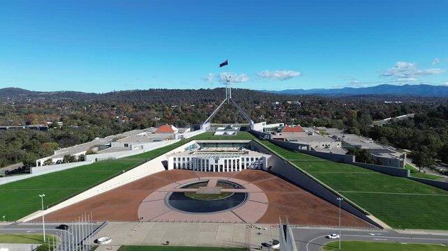 Rising Aerial Drone Shot of Australian Parliament House and Flag Mast