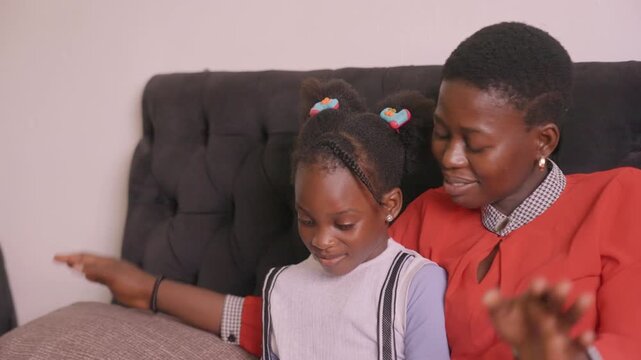 Celebrating reading success. Joyful family moment marking educational accomplishment. Heartfelt scene of parent and child celebrating literacy progress in comfortable household setting