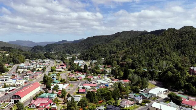 Panoramic aerial hovering over Queenstown city centre in Tasmania &ndash; historic mining.