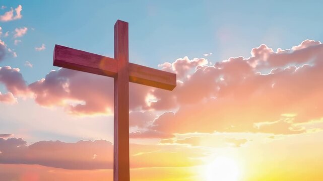 Wooden cross standing against a dramatic sunset sky