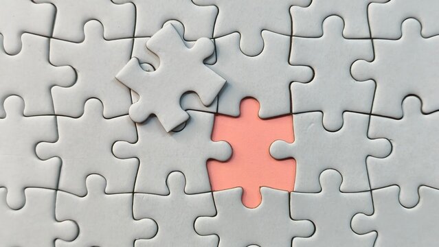 Concept of mismatch and incorrect solution with a white puzzle piece placed in the wrong position over a missing gap.
