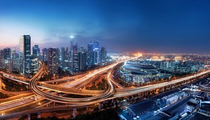 Fototapeta premium magnificent illuminated panorama of cityscape and transport infrastructure