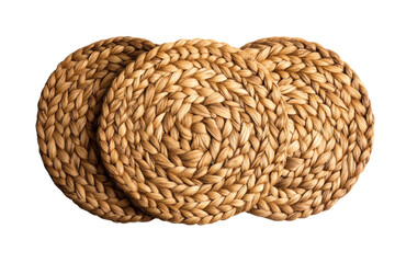 Obraz premium A set of three round woven water hyacinth placemats or coasters showing intricate braid texture in natural beige tones&nbsp;