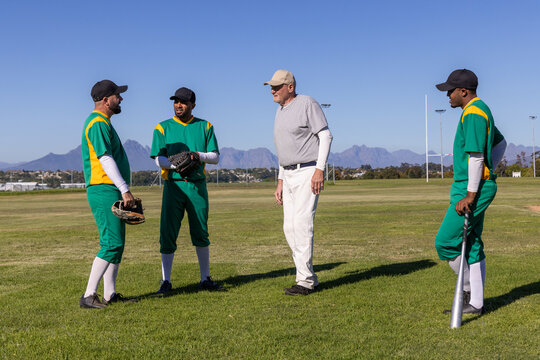 Sports coach pointing and activating animated lineup, stats marking gloves and bat for drill