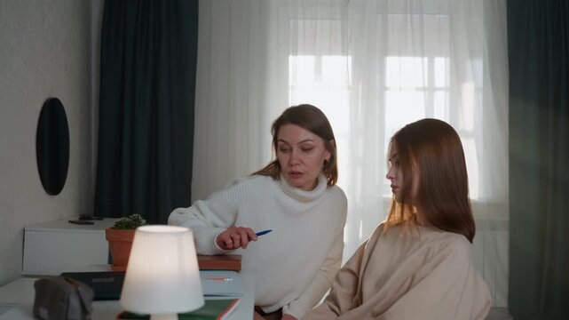 White coach leading intense exam prep, bright home study with desk lamp and plant, sunlight filtering through curtains. Coach adopts firm but constructive tone, times mock tests, gives strict grammar