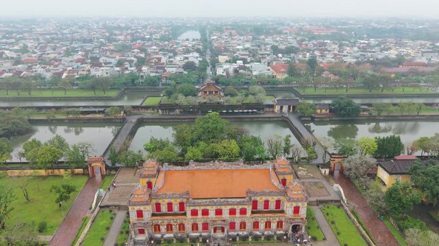 High Vantage View Of Urban Surroundings. Aerial Shot Capturing Gates Streets And Lively Atmosphere. Overhead Perspective Showcasing Historic Entry And Bustling City Environment From Above
