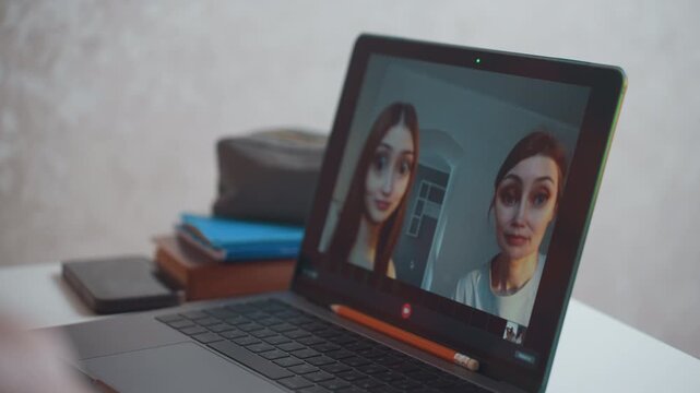 Virtual group class on laptop screen showing gallery view of participants then focused presenters, host and tutor lead live discussion with hand gestures, candid facial expressions and responsive
