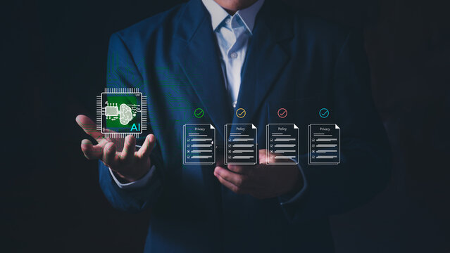 Businessman holding AI chip with digital privacy policy documents, Concept of artificial intelligence ethics, data protection, compliance, cyber security, and legal regulatory technology.