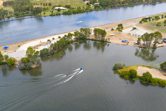 Aerial view of speedboats and water skiers on an inland lake
