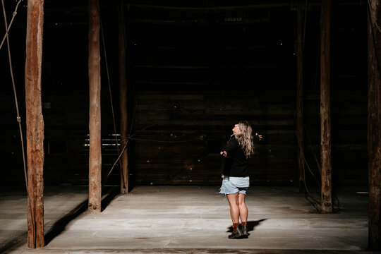 Middle age women dancing in light inside historic building